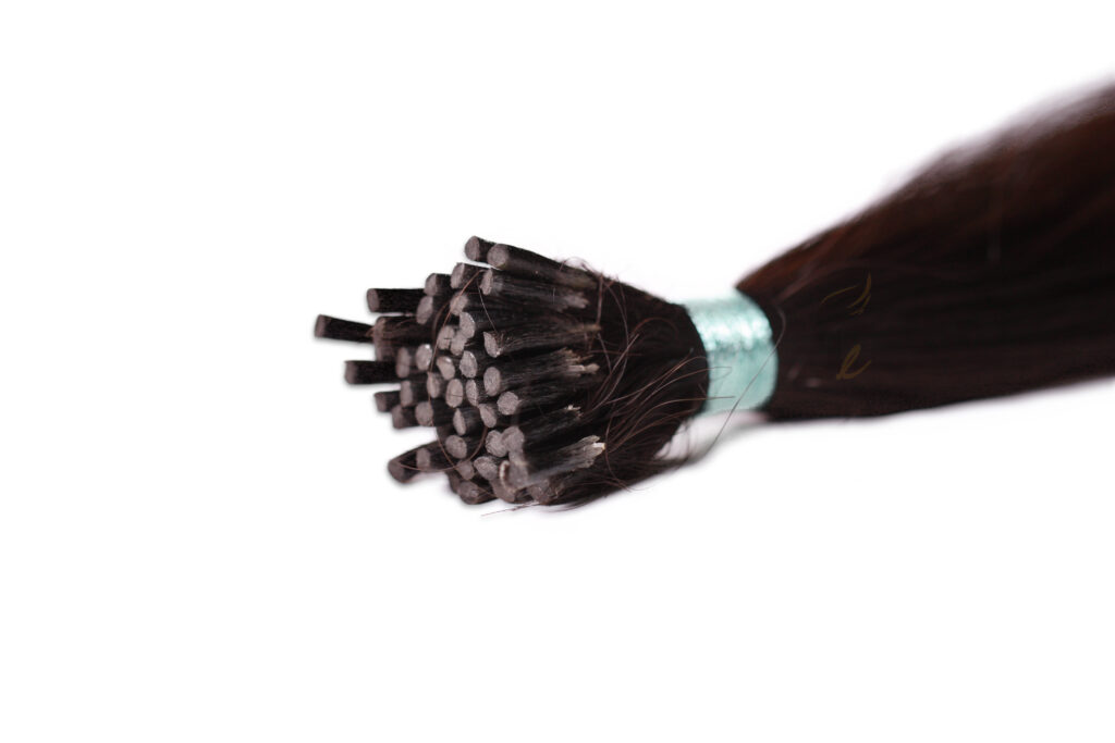 Keratin tip hair extensions: I tip, single-donor virgin Remy hair with straight stick-shaped keratin bonds