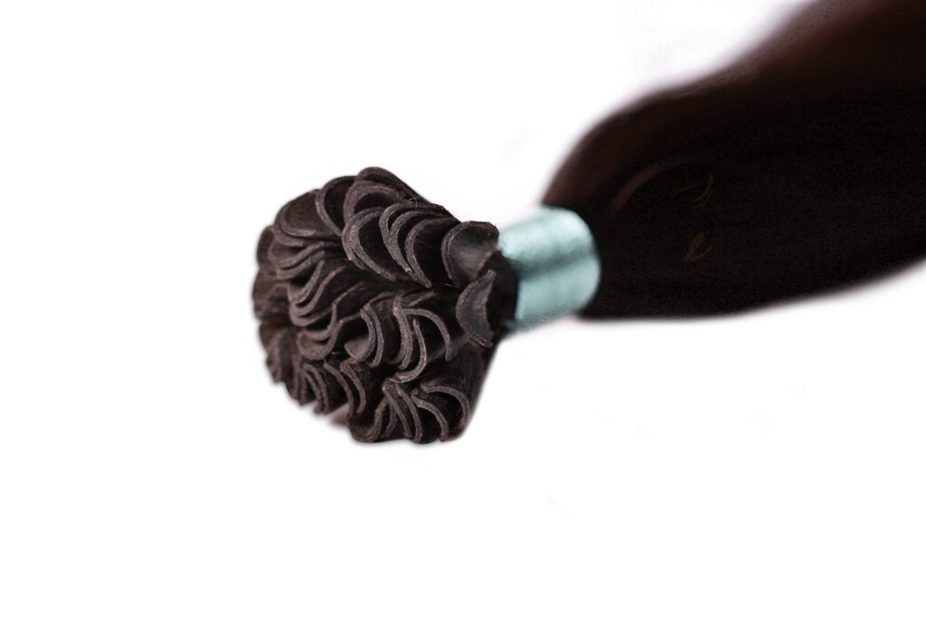 Keratin tip hair extensions: U tip, single-donor virgin Remy hair with U-shaped keratin bonds