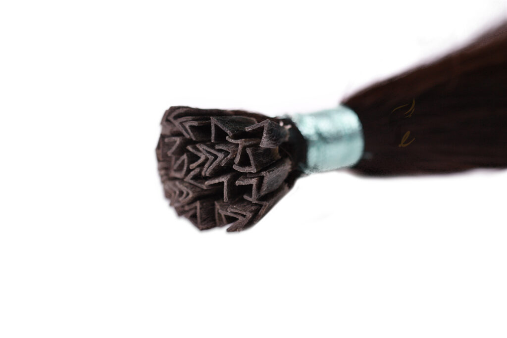 Keratin tip hair extensions: V tip, single-donor virgin Remy hair with V-shaped keratin bonds